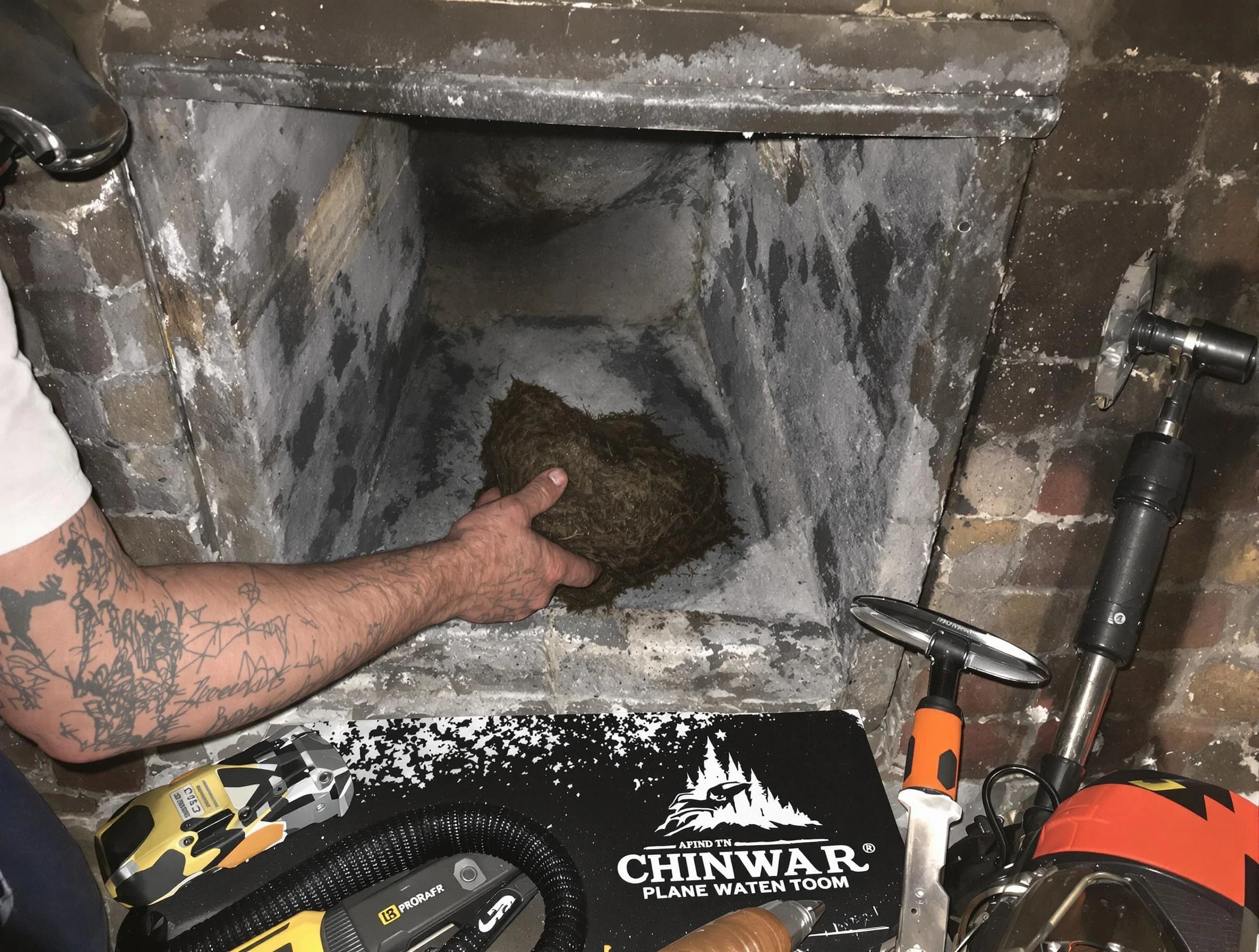 Spring Valley Chimney Sweep safely removing debris and screening chimney in Spring Valley, NY